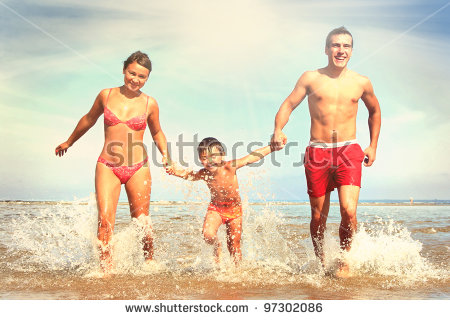 14-stock-photo-happy-family-having-fun-on-the-beach-97302086