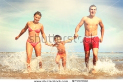 14-stock-photo-happy-family-having-fun-on-the-beach-97302086